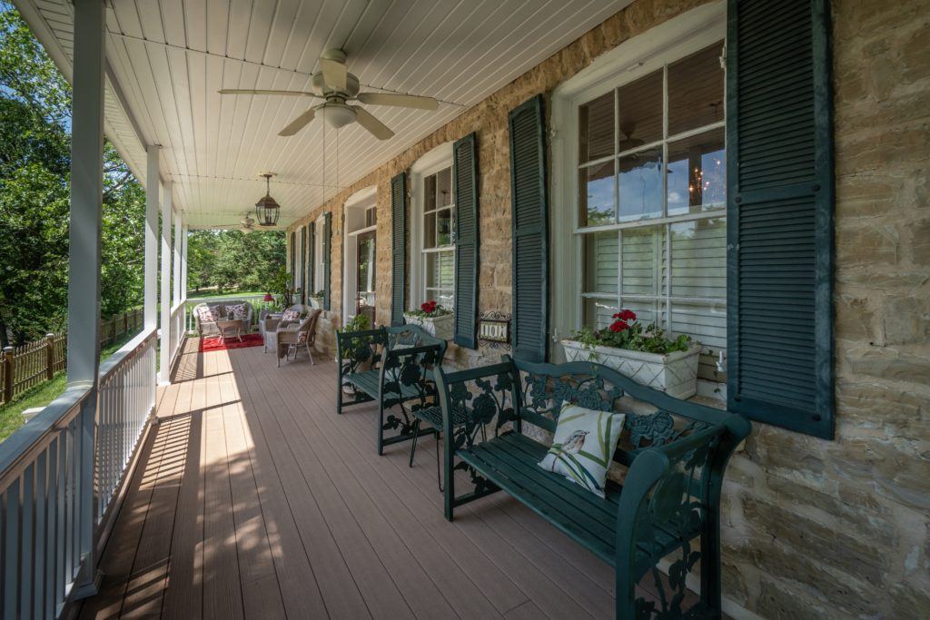 Long veranda with rocking chairs at Stone Haus